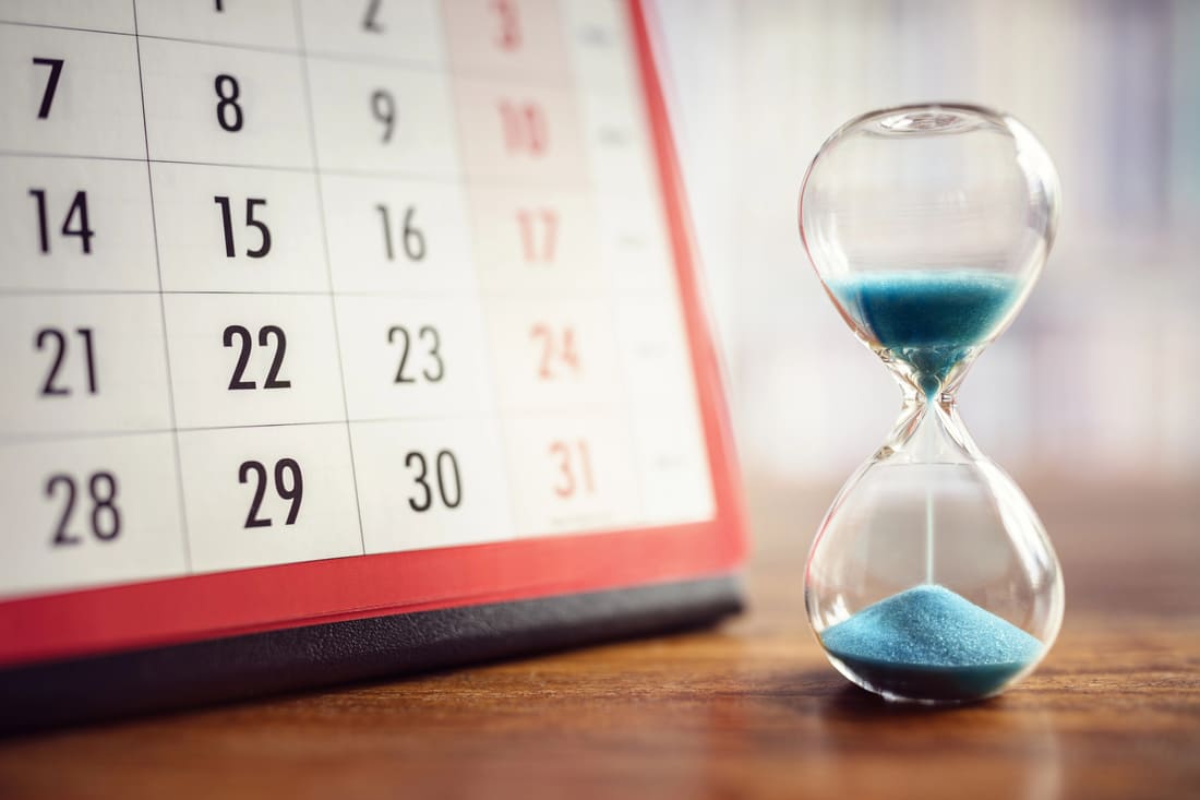 Image of a calendar and hourglass for blog "How to Develop a Year-Round Fundraising Calendar"
